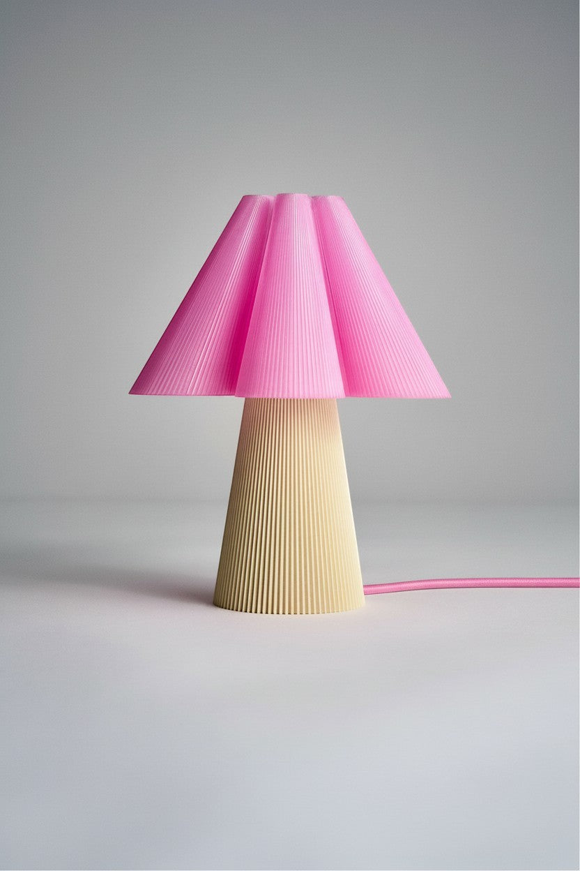 Layerd Bloom Flush table lamp with pleated pink shade and beige base, made from PLA.